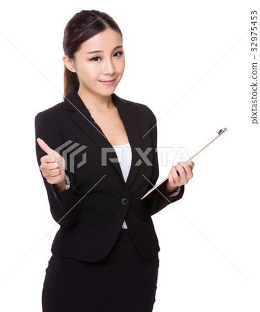 Asian young businesswoman hold with clipboard and thumb up Asian young businesswoman hold with clipboard and thumb up 32975453