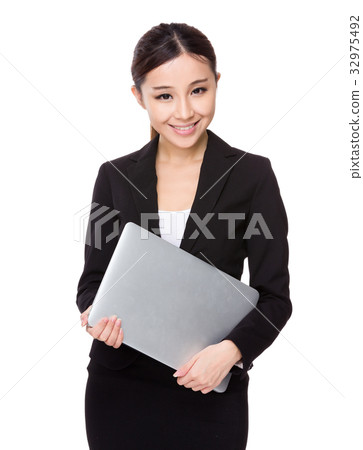 Asian businesswoman hold with laptop computer Asian businesswoman hold with laptop computer 32975492