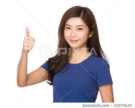 Asian Young woman showing thumb up gesture 32975624