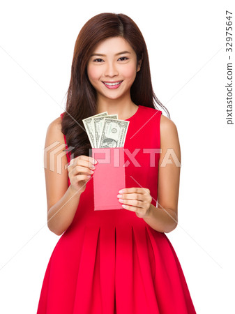 Asian young woman showing the red pocket with USD Asian young woman showing the red pocket with USD 32975647