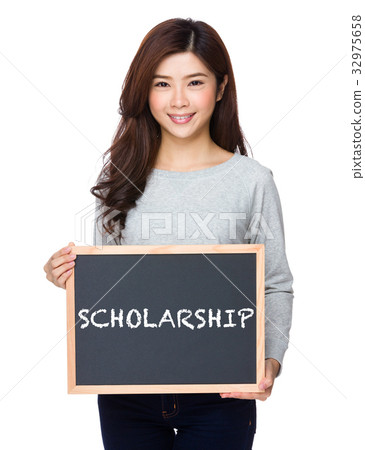 School girl hold with chalkboard and showing a word scholarship School girl hold with chalkboard and showing a word scholarship 32975658