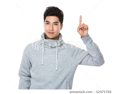 Asian young man with finger point up Asian young man with finger point up 32975789