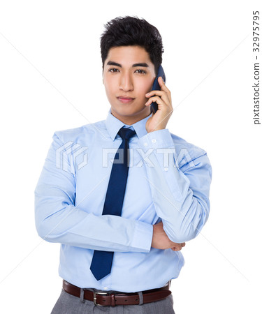 Businessman talk to cellphone Businessman talk to cellphone 32975795