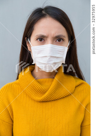 Woman feeling unwell and wearing face mask Woman feeling unwell and wearing face mask 32975955