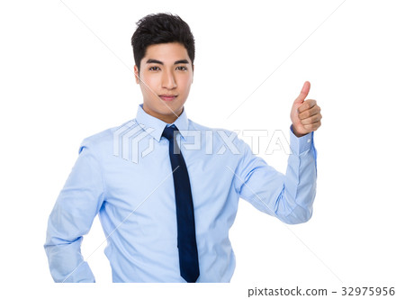 Young businessman with thumb up gesture 32975956