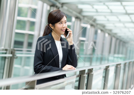 Young businesswoman talk on phone Young businesswoman talk on phone 32976207