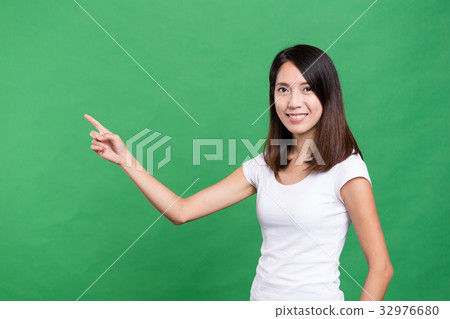 Young woman showing finger point up 32976680