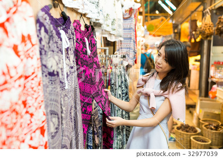 Woman shopping at weekend market Woman shopping at weekend market 32977039