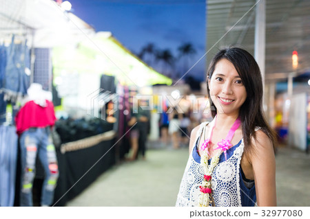 Woman shopping at night market in Thailand 32977080