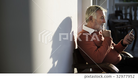Senior Man Sit Thoughful Hands Hold Mobile Senior Man Sit Thoughful Hands Hold Mobile 32977952