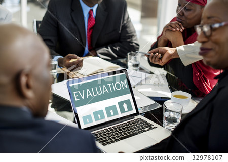 Workers working on laptop network graphic overlay 32978107