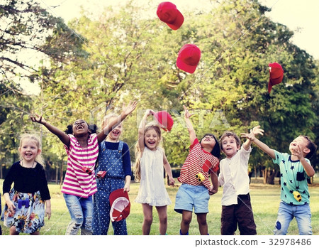 Happiness group of cute and adorable children playing in the par 32978486