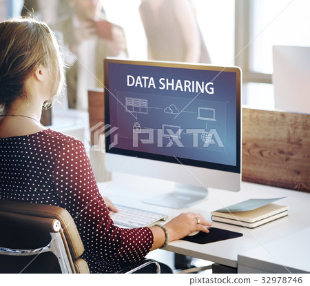 Woman using computer cloud network graphic overlay Woman using computer cloud network graphic overlay 32978746