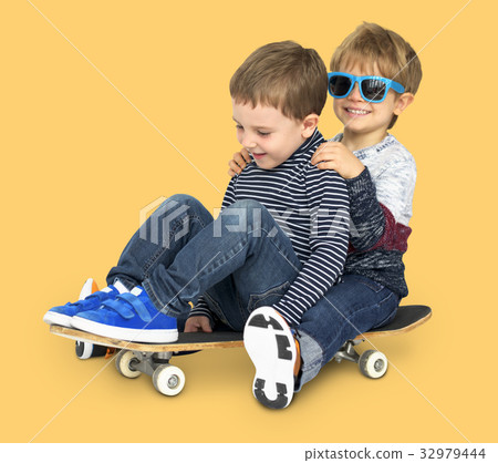 Little Kids Smiling Playing Sitting Skateboard 32979444