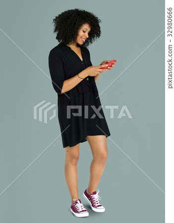 African descent woman using phone African descent woman using phone 32980666