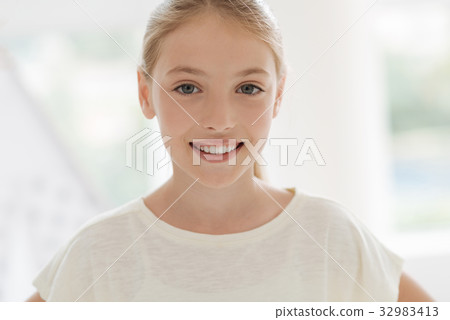 Portrait of cheerful girl smiling 32983413