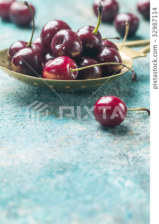 Fresh cherry in spoon Fresh cherry in spoon 32987114