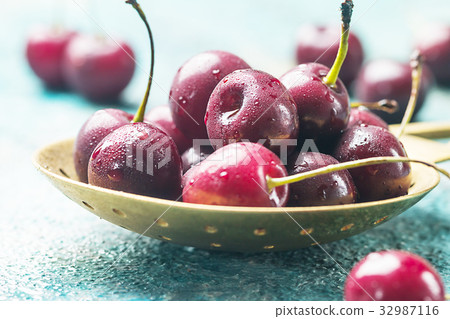 Fresh cherry in spoon Fresh cherry in spoon 32987116