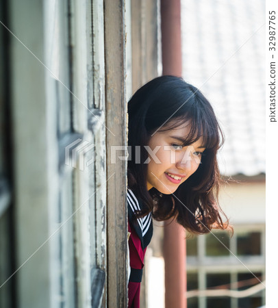 High school girl looking out of the classroom 32987765
