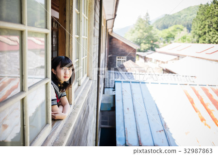 High school girl looking out of the classroom 32987863