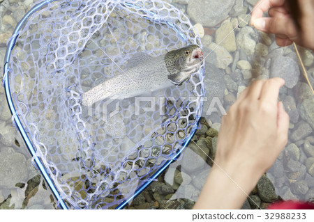 A woman enjoying fishing A woman enjoying fishing 32988233