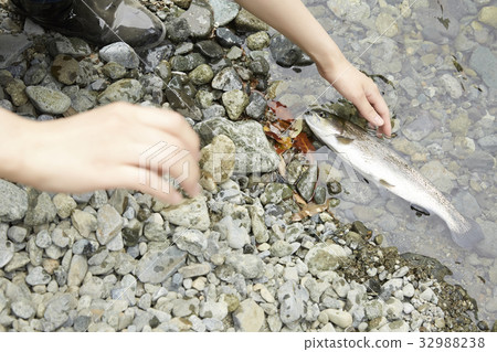 A woman enjoying fishing A woman enjoying fishing 32988238