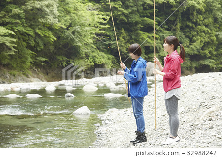 A woman enjoying fishing A woman enjoying fishing 32988242