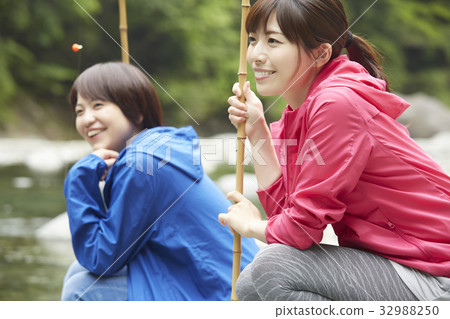 A woman enjoying fishing A woman enjoying fishing 32988250