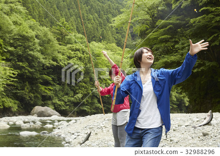 A woman enjoying fishing 32988296