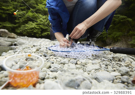 A woman enjoying fishing 32988391