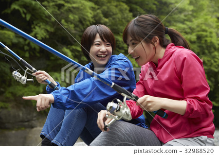 A woman enjoying fishing 32988520
