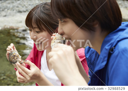 A woman enjoying a barbecue A woman enjoying a barbecue 32988529