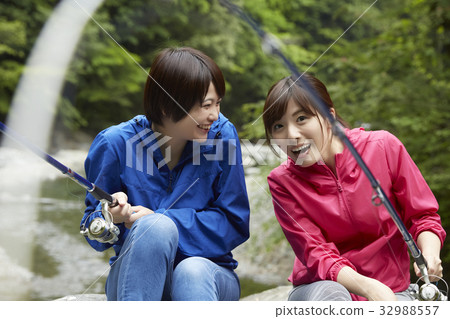 A woman enjoying fishing 32988557