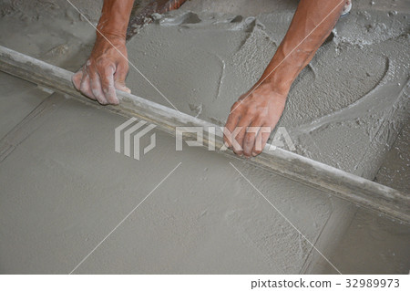 Builders are pouring concrete floors. For construc Builders are pouring concrete floors. For construc 32989973
