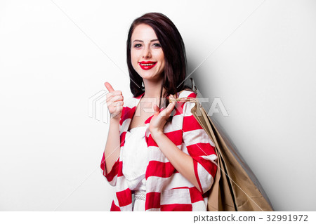 portrait of the young woman with shopping bags 32991972