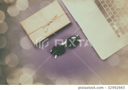 Package and laptop computer with glasses Package and laptop computer with glasses 32992665