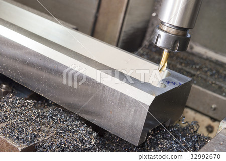 The CNC milling machine cutting the sample jig 32992670