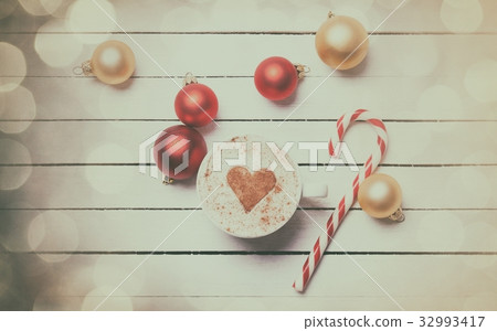 Cup of coffee and christmas candy Cup of coffee and christmas candy 32993417