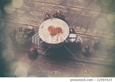 Cup of coffee on wooden background Cup of coffee on wooden background 32993425