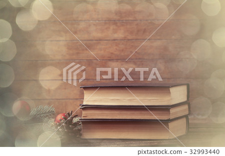 pine branch and books 32993440