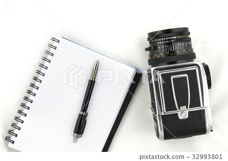 Medium format camera with notebook and pen Medium format camera with notebook and pen 32993801