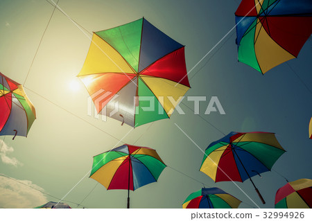 Colorful umbrella street decoration with sunlight. 32994926