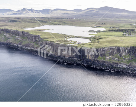 Cinematic aerial shot of the dramatic coastline at 32996323