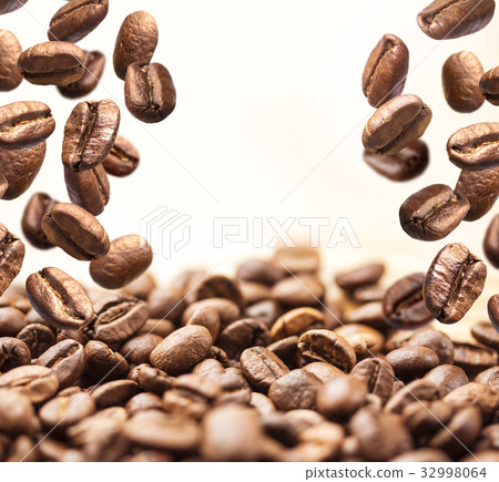Flying coffee beans on white Flying coffee beans on white 32998064