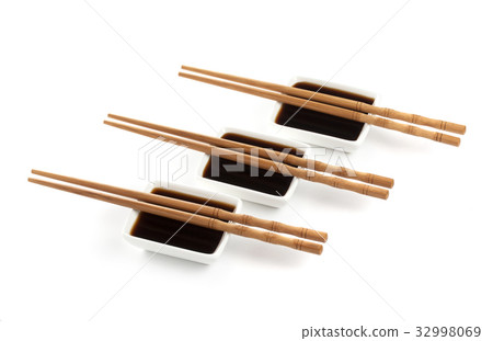 Soy sauce and chopsticks isolated on white 32998069