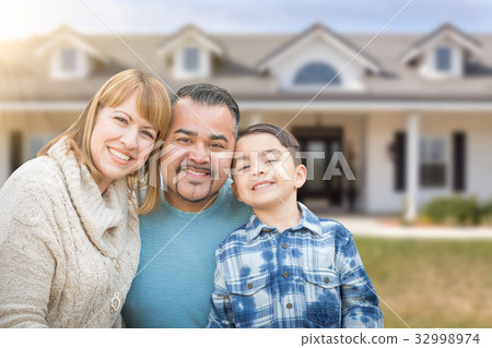 Mixed Race Family In Front Yard of Beautiful House and Property. 32998974