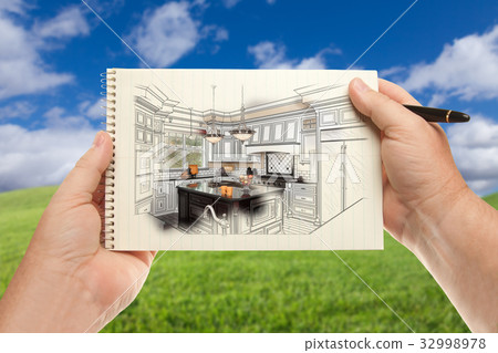 Male Hands Holding Pen and Pad of Paper Up with Custom Kitchen I 32998978