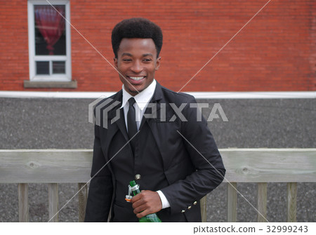 businessman smiling drinking wine holding bottle businessman smiling drinking wine holding bottle 32999243