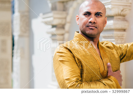 Handsom Indian Man in Gold Kurta at the Temple 32999867
