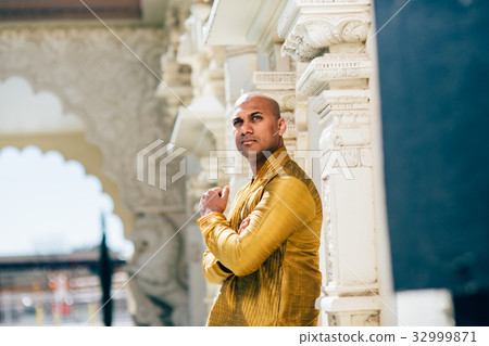 Handsom Indian Man in Gold Kurta at the Temple Handsom Indian Man in Gold Kurta at the Temple 32999871